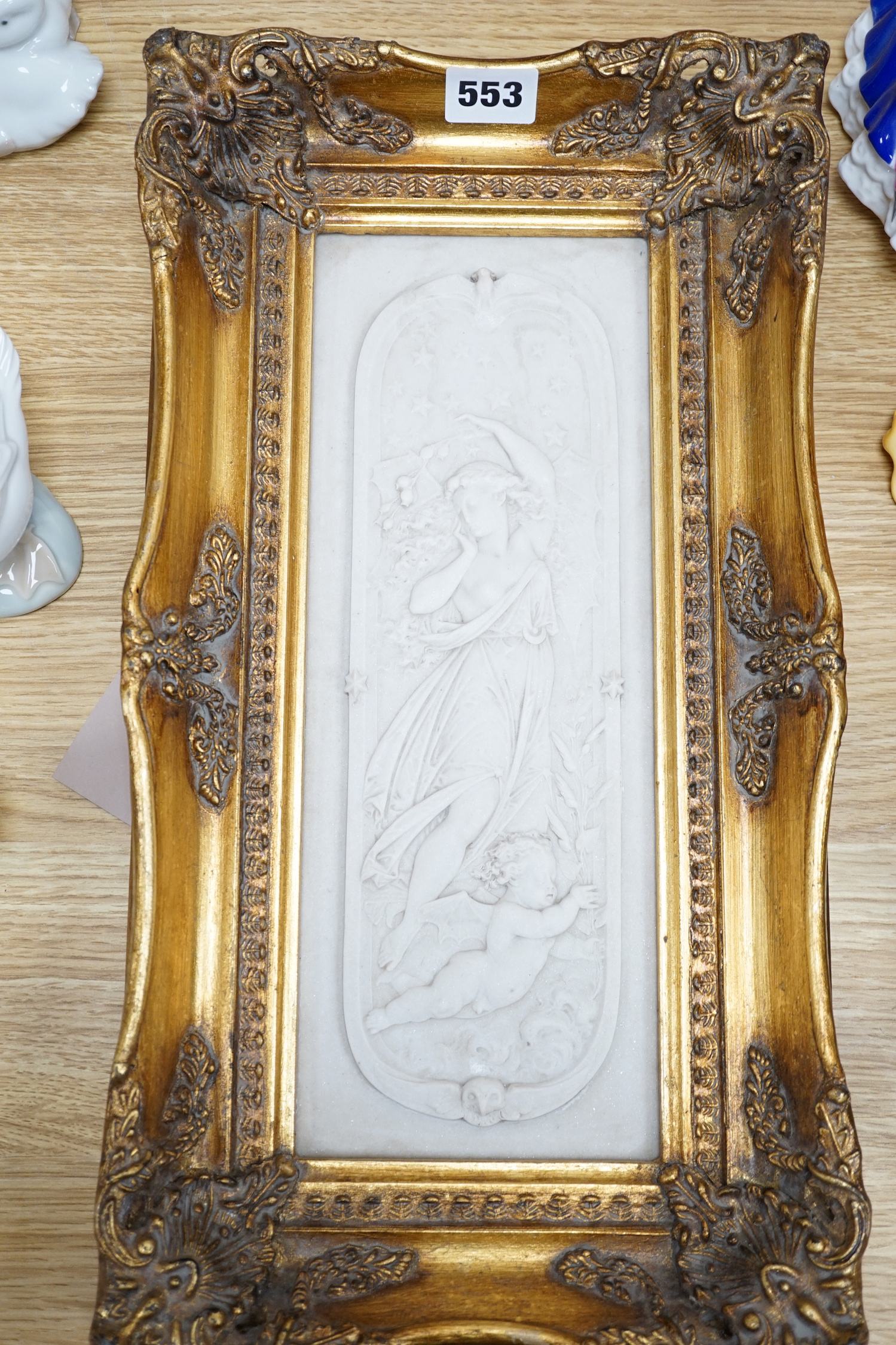 An ornate framed reconstituted stone frieze, 42 x 23cm